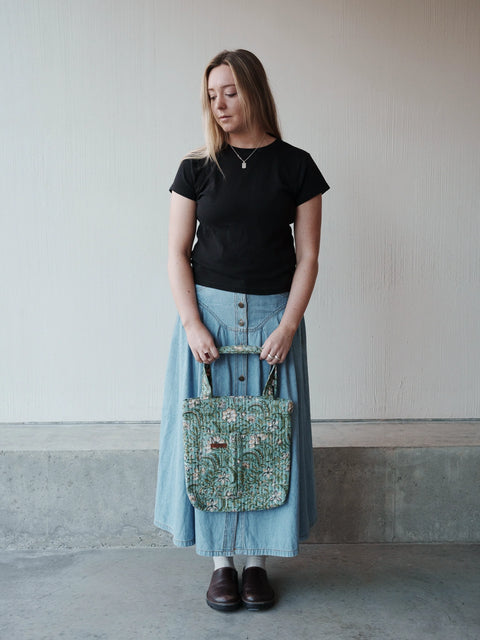 Designed for everyday life, our Pocket Tote blends simplicity with functionality. Featuring two roomy front patch pockets and a spacious main compartment, it keeps your everyday essentials organized and within easy reach. The quilted construction adds softness and durability, while the comfortable shoulder straps make it easy to carry wherever the day takes you. Thoughtfully handcrafted for practical, everyday living.
Features
Quilted cotton construction
Two spacious front patch pockets
Large main compart